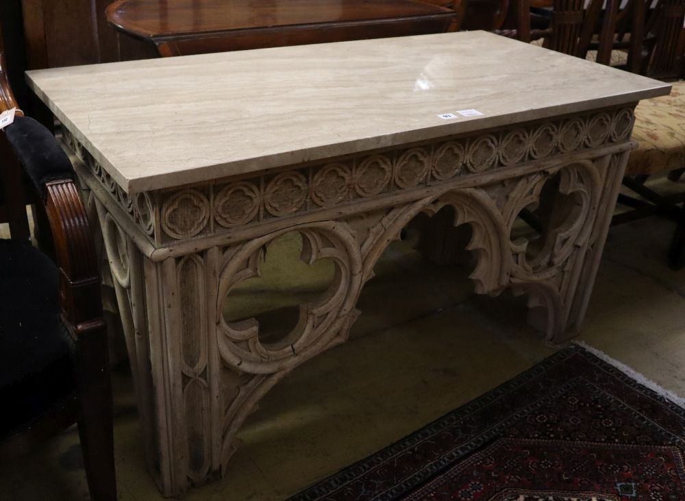 A Gothic style marble top bleached oak console table, width 122cm, depth 58cm, height 66cm